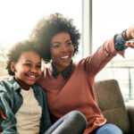 Cropped shot of a young woman and her daughter sitting together at home