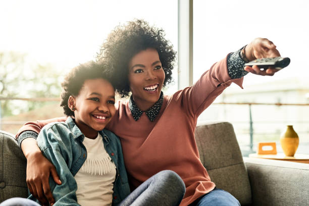 Cropped shot of a young woman and her daughter sitting together at home